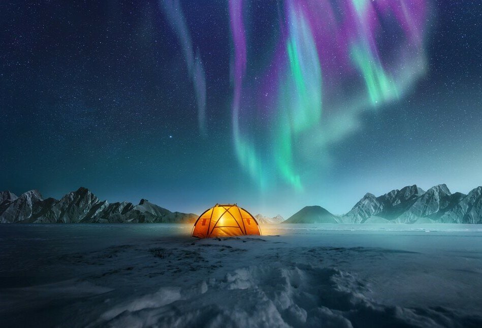 Image of the Northern Lights (Aurora Borealis) over a Norwegian fjord